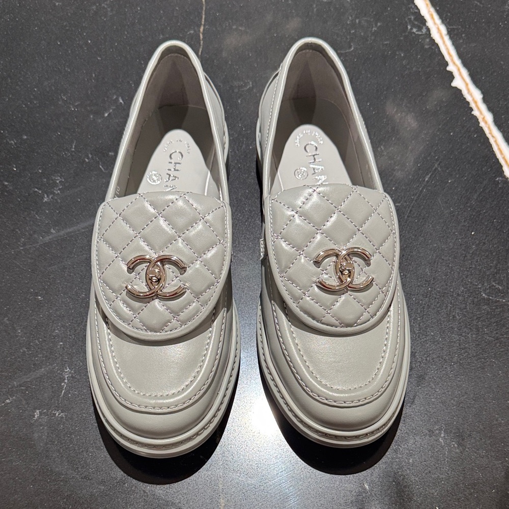 CHANEL Grey Quilted Loafers with silver  Logo